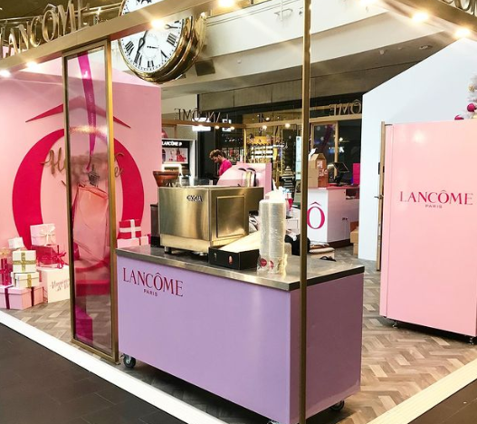 Lancôme Paris branded mobile espresso bar and beverage station at a premium retail event