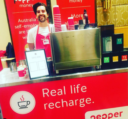 Pepper Money branded mobile coffee and T2 tea bar with professional barista at a corporate function
