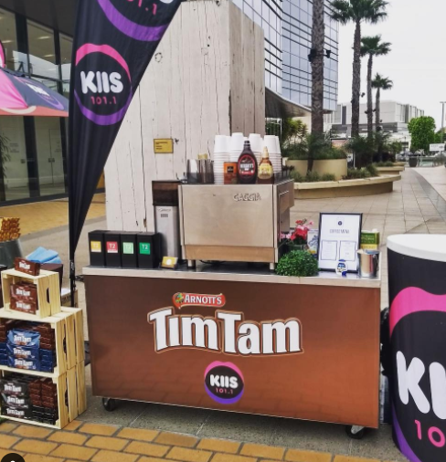 Tim Tam and KIIS 101.1 branded mobile coffee bar hire by Liquid Infusion at an outdoor activation